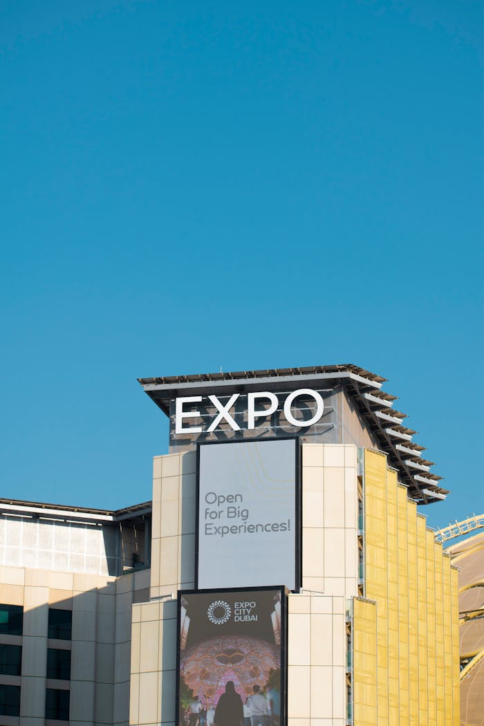Home A stunning view of the Expo building in Dubai against a vivid blue sky, showcasing modern architecture.